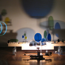 "Head On Horizon Redux", 2010. Aluminum, wood, glass, LED light, motor, video. 48" x 28" x 144"